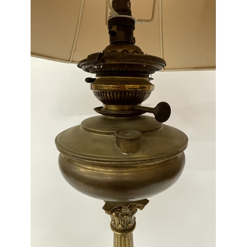 43 - A LARGE BRASS OIL LAMP WITH CORINTHIAN COLUMN, CONVERTED TO ELECTRIC, WITH SHADE, HEIGHT APPROX 64CM