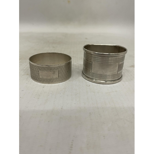 8 - FOUR HALLMARKED BIRMINGHAM SILVER ITEMS TO INCLUDE TWO NAPKIN RINGS AND TWO DECANTER LABELS