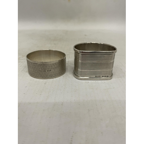 8 - FOUR HALLMARKED BIRMINGHAM SILVER ITEMS TO INCLUDE TWO NAPKIN RINGS AND TWO DECANTER LABELS