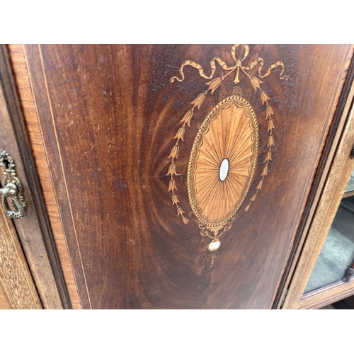 3245 - AN EDWARDIAN MAHOGANY AND INLAID SHERATON REVIVAL BOW FRONTED CHINA CABINET ON OPEN BASE WITH TAPERI... 