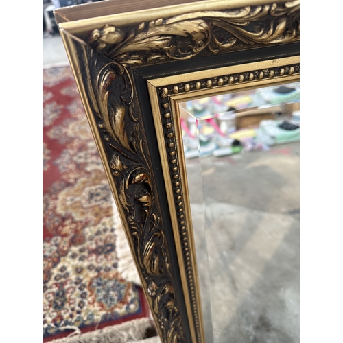 3249 - A GILT FRAMED BEVEL EDGE MIRROR