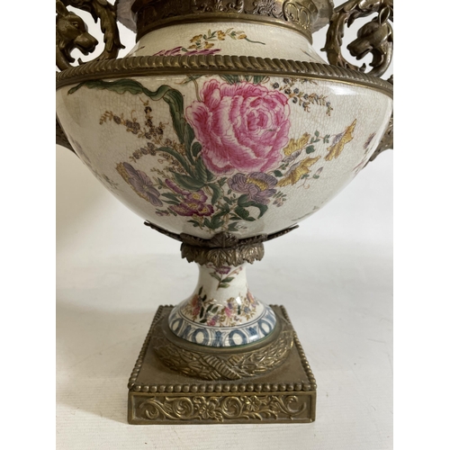 1 - A LARGE PORCELAIN URN WITH BRONZE ACCENTS, POSSIBLY CHINESE.  FEATURING A FLORAL DESIGN WITH ANIMAL ... 