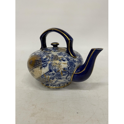 13 - A CIRCA 1880, DOULTON TEAPOT WITH JAPANESE INSPIRED DESIGN IN BLUE AND WHITE WITH GILT HIGHLIGHTS AN... 