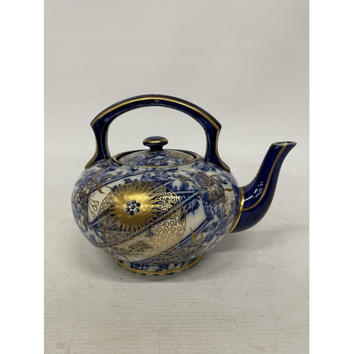 13 - A CIRCA 1880, DOULTON TEAPOT WITH JAPANESE INSPIRED DESIGN IN BLUE AND WHITE WITH GILT HIGHLIGHTS AN... 