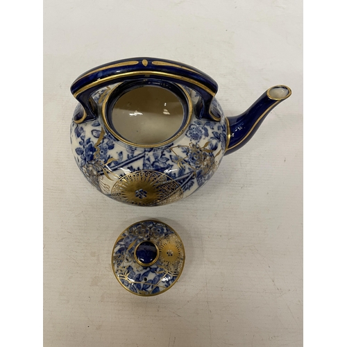 13 - A CIRCA 1880, DOULTON TEAPOT WITH JAPANESE INSPIRED DESIGN IN BLUE AND WHITE WITH GILT HIGHLIGHTS AN... 