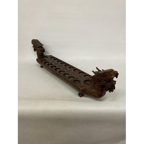 26 - A VINTAGE HARDWOOD ORIENTAL DRAGON SHAPED 'MONCALA' COUNT AND CATCH GAME (NO COUNTERS) - LENGTH 89CM