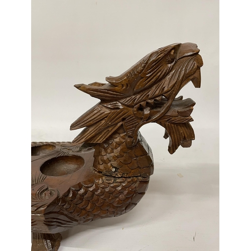 26 - A VINTAGE HARDWOOD ORIENTAL DRAGON SHAPED 'MONCALA' COUNT AND CATCH GAME (NO COUNTERS) - LENGTH 89CM