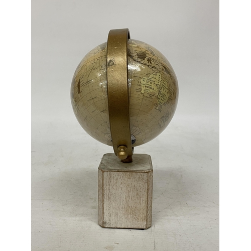 40 - A WORLD GLOBE ON A WOODEN BASE, HEIGHT 25CM