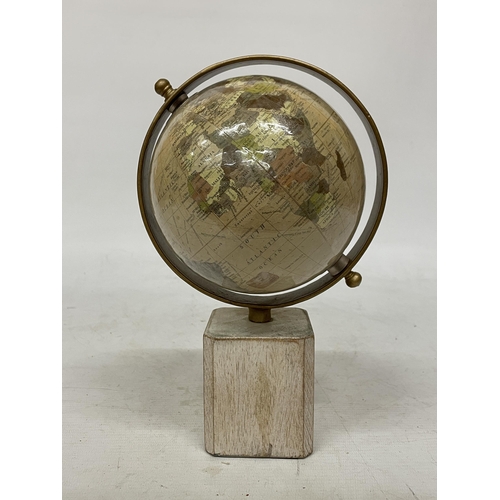 40 - A WORLD GLOBE ON A WOODEN BASE, HEIGHT 25CM