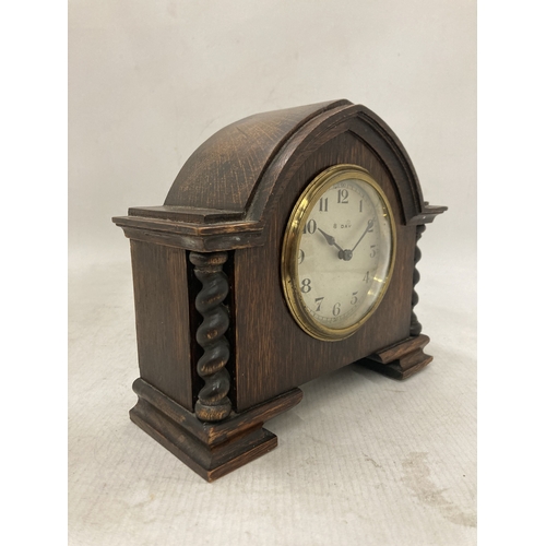 105 - A RARE ANTIQUE FRENCH EIGHT DAY MANTLE CLOCK IN A SOLID WOOD CASE WITH BARLEY TWIST COLUMNS CIRCA 19... 