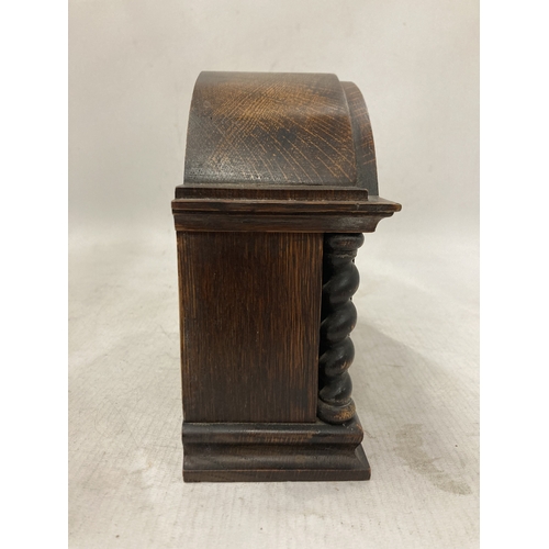 105 - A RARE ANTIQUE FRENCH EIGHT DAY MANTLE CLOCK IN A SOLID WOOD CASE WITH BARLEY TWIST COLUMNS CIRCA 19... 