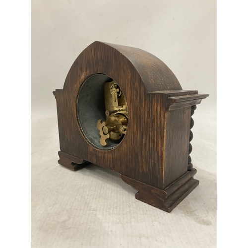 105 - A RARE ANTIQUE FRENCH EIGHT DAY MANTLE CLOCK IN A SOLID WOOD CASE WITH BARLEY TWIST COLUMNS CIRCA 19... 