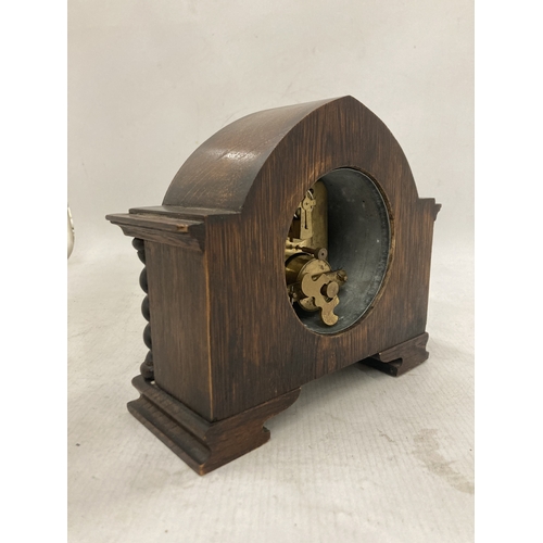 105 - A RARE ANTIQUE FRENCH EIGHT DAY MANTLE CLOCK IN A SOLID WOOD CASE WITH BARLEY TWIST COLUMNS CIRCA 19... 