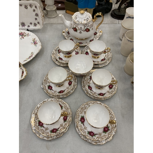 157 - A ROSLYN CHINA RED ROSE AND GOLD GILT TEASET TO INCLUDE A TEAPOT, SUGAR BOWL, CUPS, SAUCERS AND SIDE... 