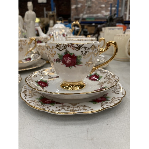 157 - A ROSLYN CHINA RED ROSE AND GOLD GILT TEASET TO INCLUDE A TEAPOT, SUGAR BOWL, CUPS, SAUCERS AND SIDE... 