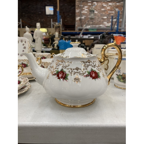 157 - A ROSLYN CHINA RED ROSE AND GOLD GILT TEASET TO INCLUDE A TEAPOT, SUGAR BOWL, CUPS, SAUCERS AND SIDE... 