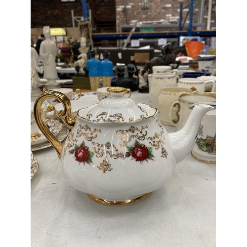 157 - A ROSLYN CHINA RED ROSE AND GOLD GILT TEASET TO INCLUDE A TEAPOT, SUGAR BOWL, CUPS, SAUCERS AND SIDE... 