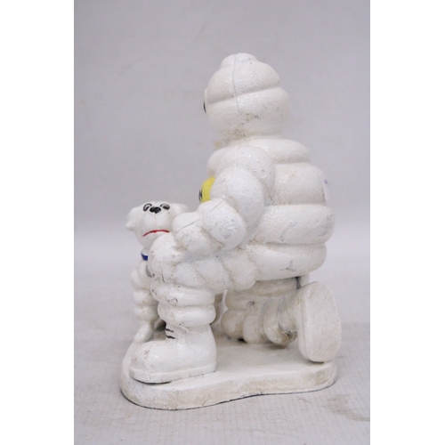 254 - A CAST MICHELIN MAN AND DOG, HEIGHT 20CM