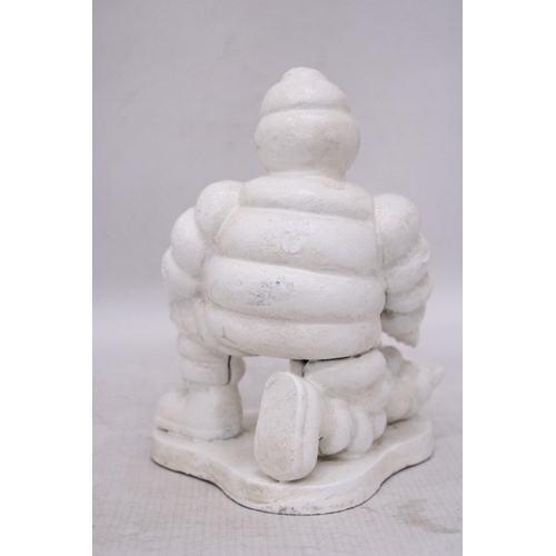 254 - A CAST MICHELIN MAN AND DOG, HEIGHT 20CM