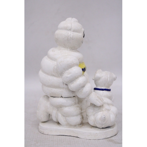 254 - A CAST MICHELIN MAN AND DOG, HEIGHT 20CM