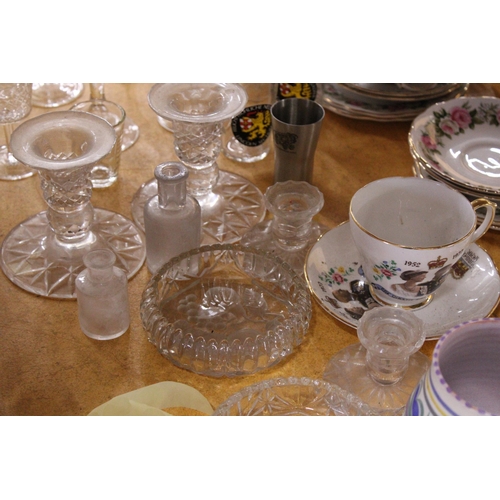 396 - A QUANTITY OF GLASSWARE TO INCLUDE DRINKING GLASSES, CANDLESTICKS, ETC., TOGETHER WITH A POOLE POTTE... 