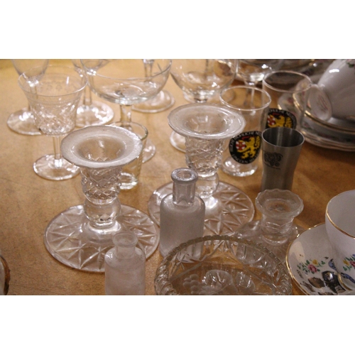 396 - A QUANTITY OF GLASSWARE TO INCLUDE DRINKING GLASSES, CANDLESTICKS, ETC., TOGETHER WITH A POOLE POTTE... 