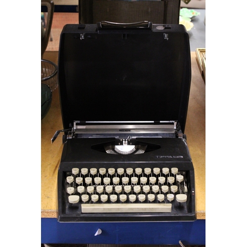 402 - A CASED IMPERIAL GOOD COMPANION MANUAL TYPEWRITER TOGETHER WITH A TRIUMPH TIPPA TYPEWRITER