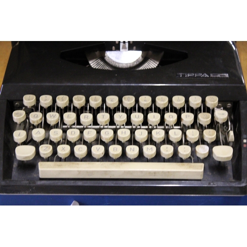 402 - A CASED IMPERIAL GOOD COMPANION MANUAL TYPEWRITER TOGETHER WITH A TRIUMPH TIPPA TYPEWRITER