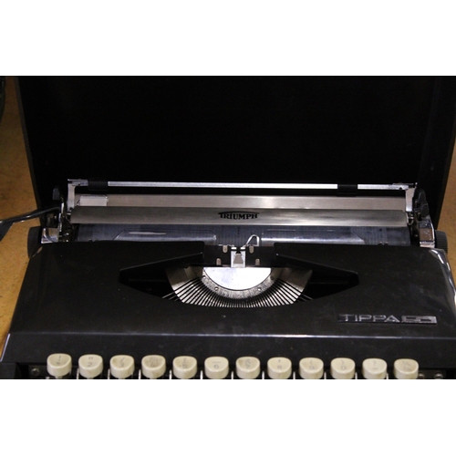 402 - A CASED IMPERIAL GOOD COMPANION MANUAL TYPEWRITER TOGETHER WITH A TRIUMPH TIPPA TYPEWRITER