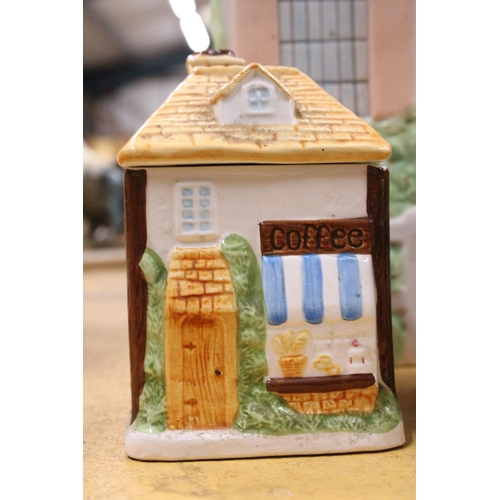 409 - A CERAMIC COTTAGE STYLE BREAD BIN WITH TEA, COFFEE AND SUGAR