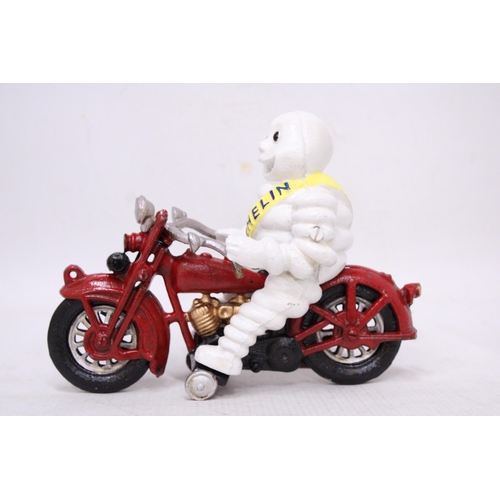 434 - A CAST MICHELIN MAN ON A MOTORBIKE, HEIGHT 16CM, LENGTH 21CM