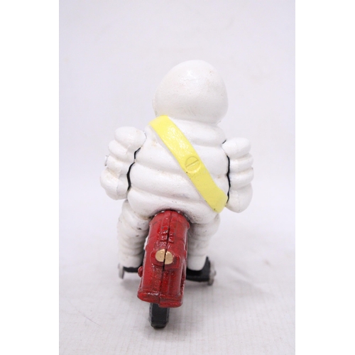 434 - A CAST MICHELIN MAN ON A MOTORBIKE, HEIGHT 16CM, LENGTH 21CM