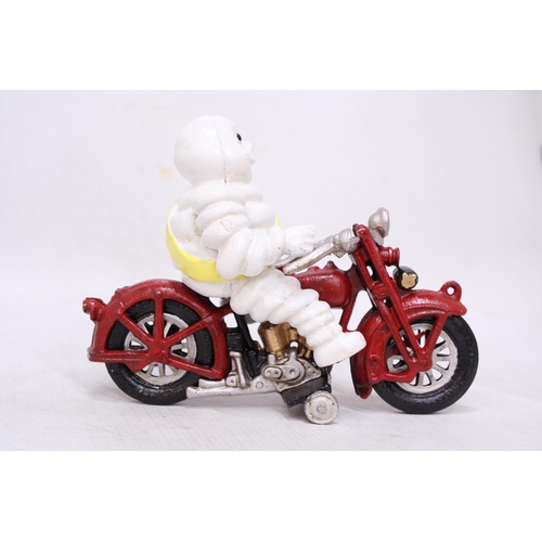 434 - A CAST MICHELIN MAN ON A MOTORBIKE, HEIGHT 16CM, LENGTH 21CM