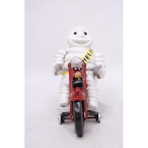 434 - A CAST MICHELIN MAN ON A MOTORBIKE, HEIGHT 16CM, LENGTH 21CM