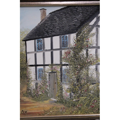 478 - A FRAMED OIL PAINTING OF A COUNTRY COTTAGE SIGNED P.R. FREEMAN TOGETHER WITH A FRAMED CROSS STITCH C... 