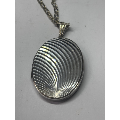 590 - A MARKED SILVER LOCKET WITH SILVER CHAIN IN A PRESENTATION BOX