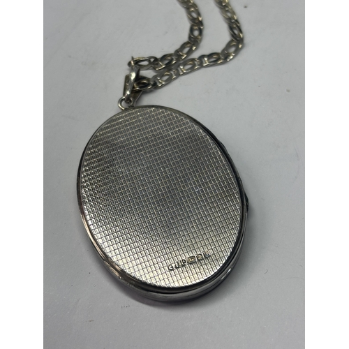 590 - A MARKED SILVER LOCKET WITH SILVER CHAIN IN A PRESENTATION BOX