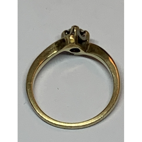 604 - A MARKED 9 CARAT GOLD RING WITH SOLITAIRE DIAMOND ON A TWIST DESIGN SIZE I/J