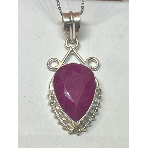 656A - A MARKED 925 NECKLACE WITH A RUBY COLOURED PENDANT IN A PRESENTATION BOX