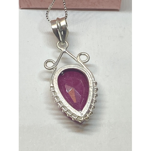 656A - A MARKED 925 NECKLACE WITH A RUBY COLOURED PENDANT IN A PRESENTATION BOX