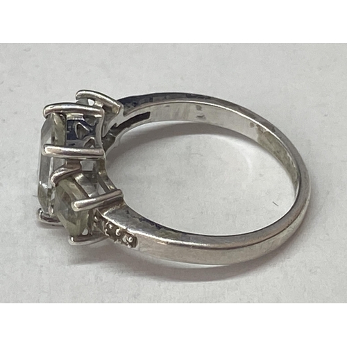 689A - A SILVER DRESS RING WITH THREE IN LINE RECTANGULAR CLEAR STONES SIZE N/O IN A PRESENTATION BOX