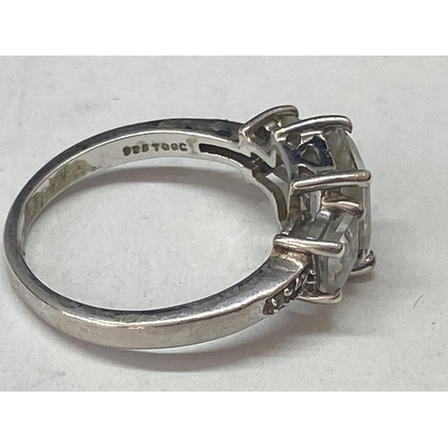 689A - A SILVER DRESS RING WITH THREE IN LINE RECTANGULAR CLEAR STONES SIZE N/O IN A PRESENTATION BOX