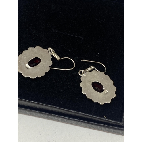 690A - A PAIR OF MARKED 925 EARRINGS WITH RED STONES IN A PRESENTATION BOX