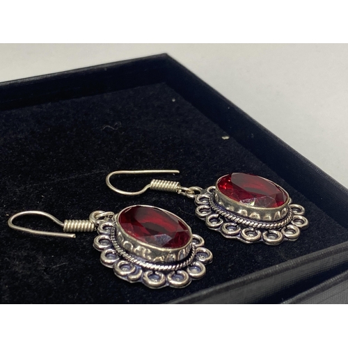 690A - A PAIR OF MARKED 925 EARRINGS WITH RED STONES IN A PRESENTATION BOX