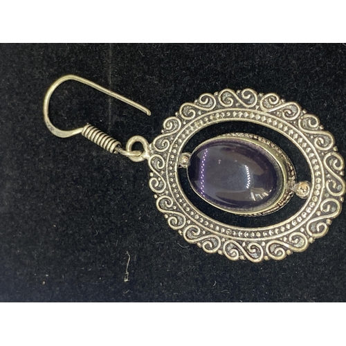 698A - A PAIR OF MARKED 925 EARRINGS WITH PURPLE STONES IN A PRESENTATION BOX