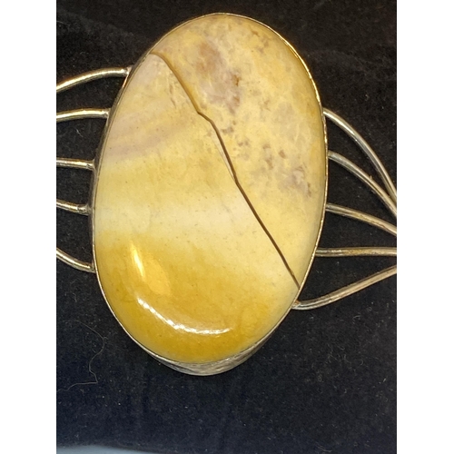 700 - A MARKED 925 BANGLE WITH LARGE JASPER STONE ( NOT CRACKED, IS A NATURAL INCLUSION)