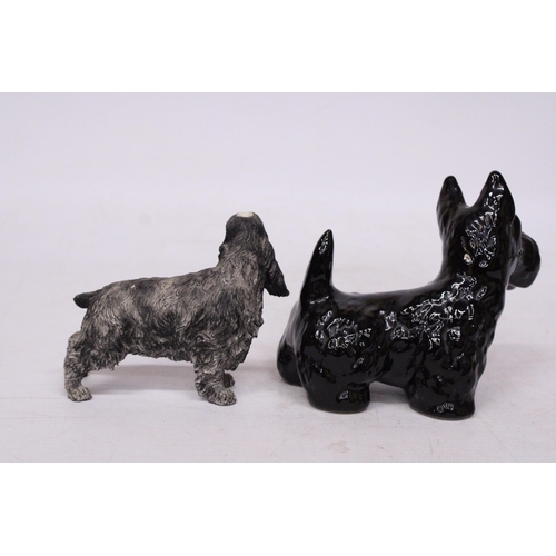 758 - TWO DOG FIGURES TO INCLUDE A SPANIEL AND A BLACK WEST HIGHLAND TERRIER