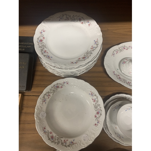 946 - A POLISH CHINA TEASET TO INCLUDE DINNER PLATES, SOUP BOWLS, A SERVING PLATE, CUPS, SAUCERS, SIDE PLA... 