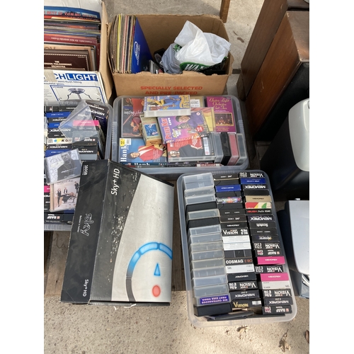 2279 - A LARGE ASSORTMENT OF VHS VIDEOS AND RECORDS ETC