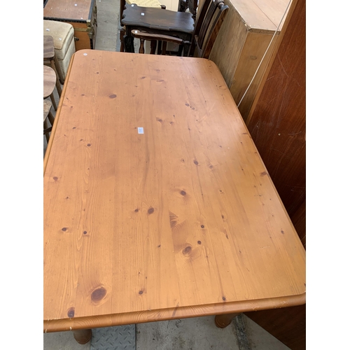 2602 - A PINE KITCHEN TABLE ON TURNED LEGS, 55